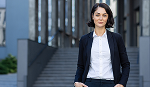 Woman standing in front of a bank contemplating going beyond the Banks and Turning to Private Lending